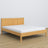Double bed natural pine – wooden headboard, close-up of wood quality