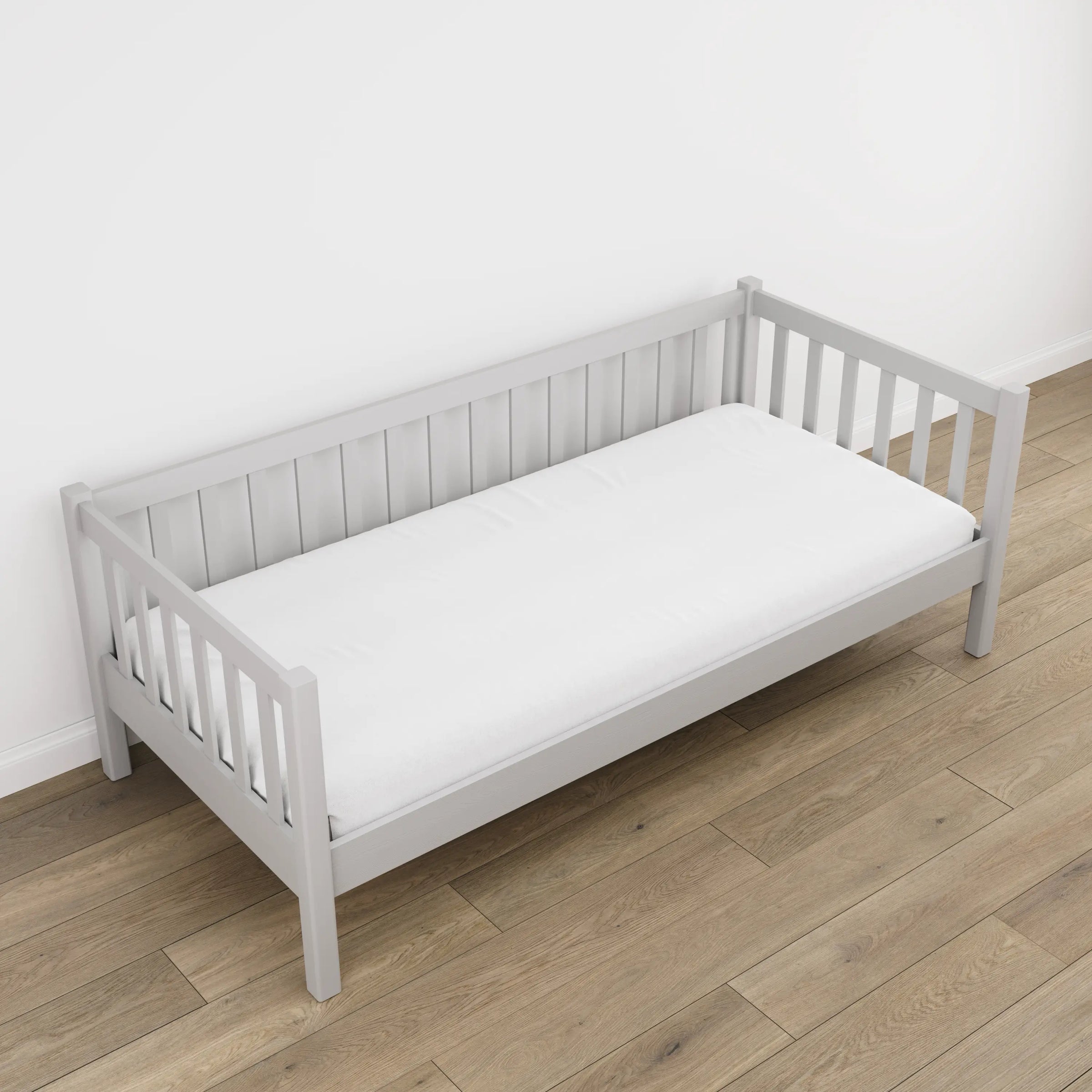 Grey sofa bed in a child’s room – scandi arrangement, wooden